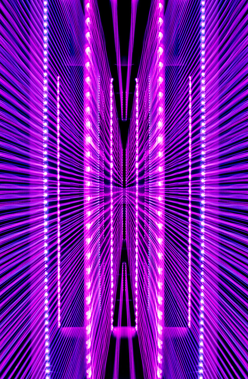 An electrifying Fine Art Photograph created through light painting, inspired by the pulsating rhythms of EDM. Vivid lilac hues and sharp, rebellious light trails intertwine in motion, capturing the raw energy of electronic punk. Using a long exposure, the tracers twist and weave through sound, creating a bold yet harmonious composition. Available as a Diasec TruLife® Acrylic Fine Art Print, a Lumachrome® TruLife® Acrylic Fine Art Print or an HD Finish® Metal Fine Art Print — all offering exceptional visual brilliance, durability and gallery-grade quality.